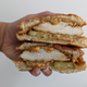 Pollo campero chicken sandwich, sliced in half to show interior